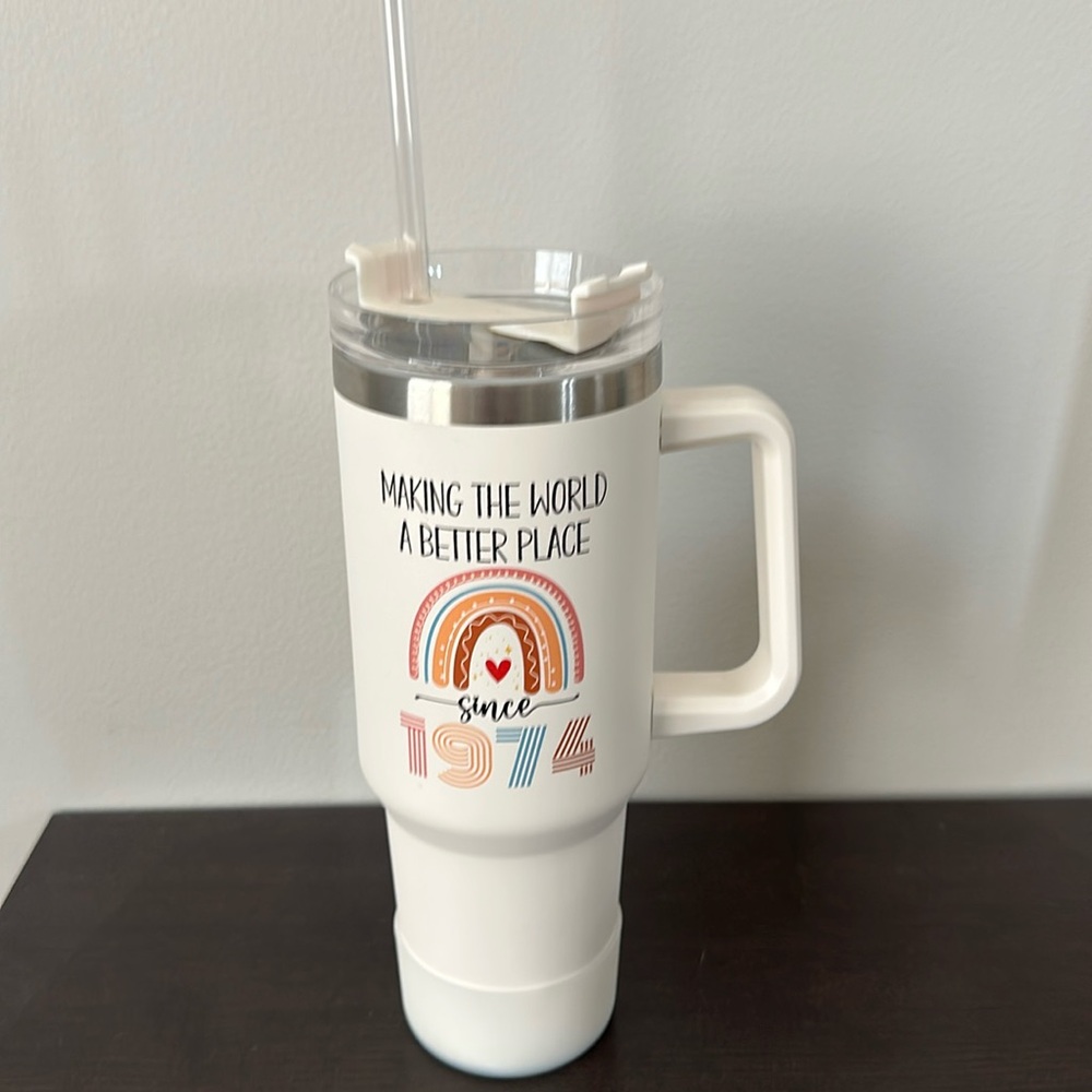 "Making the world a better place since 1974" tumbler with lid and straw